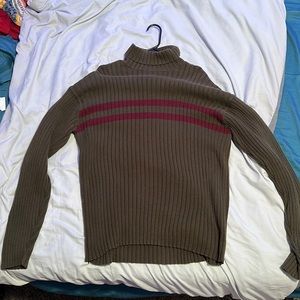 green turtleneck sweater with red stripes. fall vibes